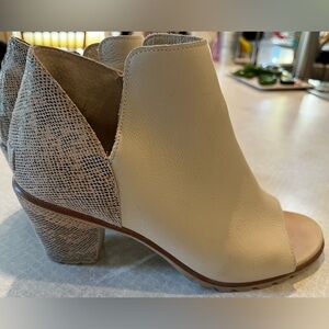 Sorel Nadia Booties. Crème with snakeskin ankle accent